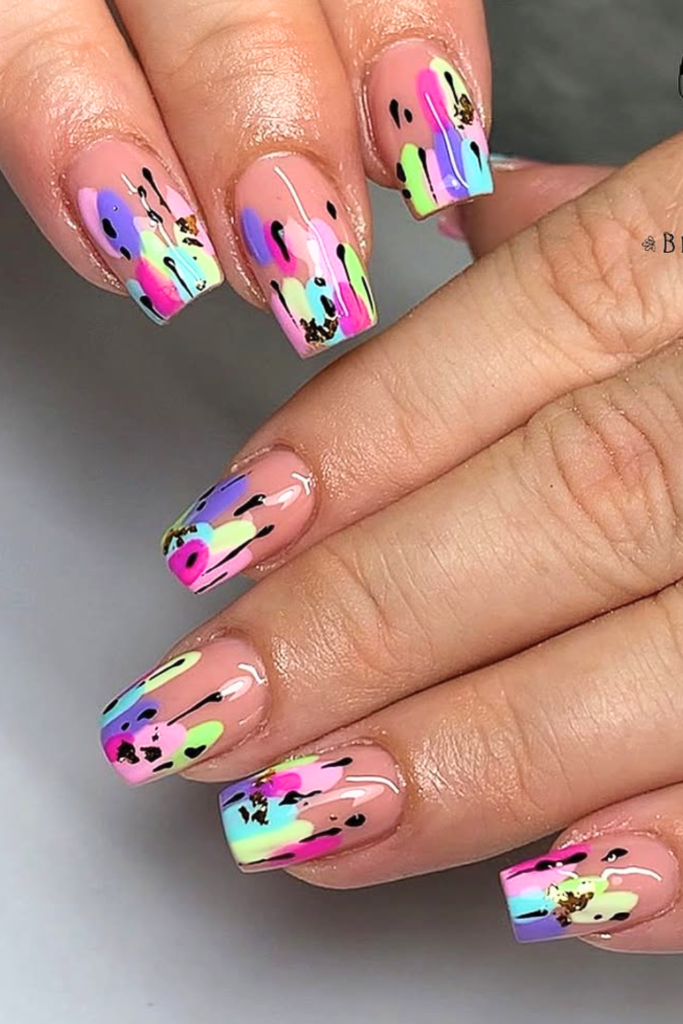Abstract color splash festival nails with bold artistic patterns and colorful nail design