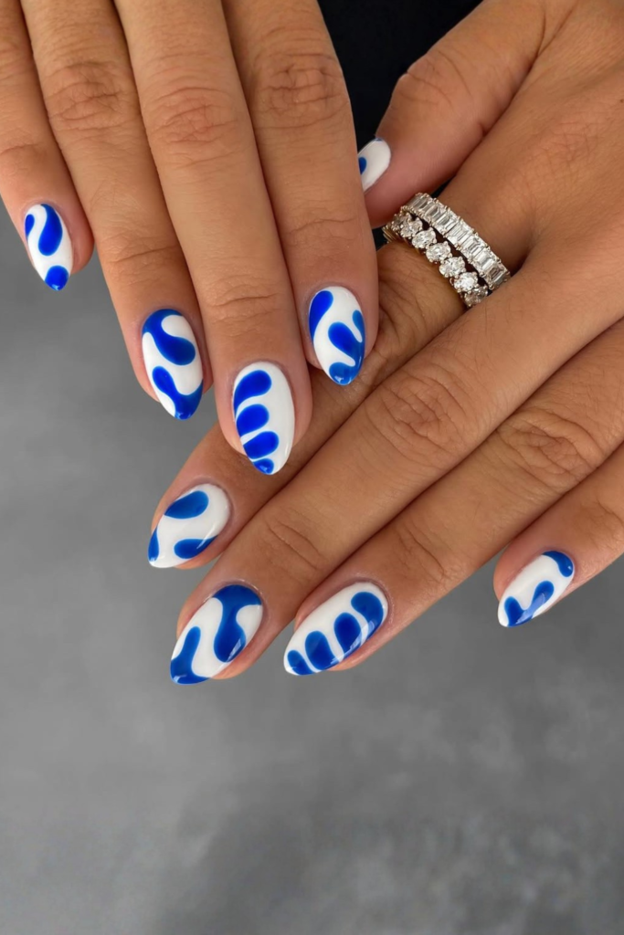 abstract blue nail art with white accents modern nail design