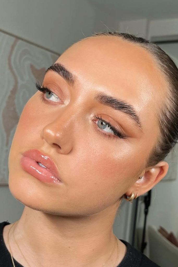 minimal makeup with bare skin, glossy lips and natural glow finish