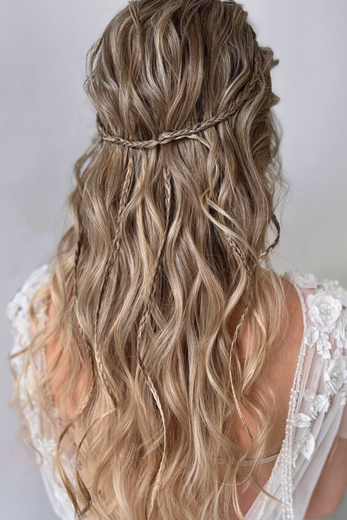 Boho braided crown festival hairstyle with soft waves and face framing pieces