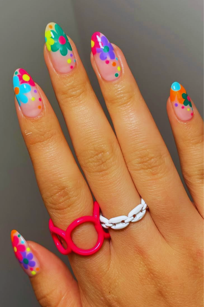 Boho floral Coachella nails with soft flower patterns and earthy festival nail design