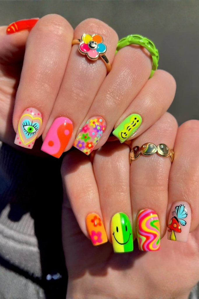 Bright mismatched color nails with bold summer shades and trendy colorful nail design