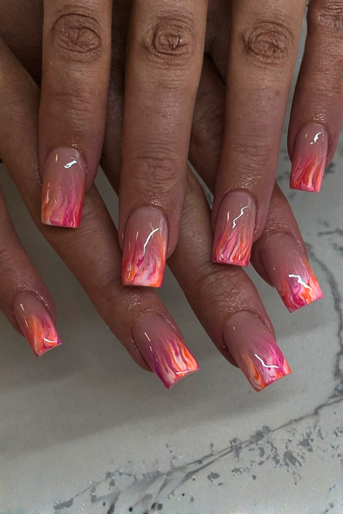 Bright tropical festival nails with vibrant summer colors and fun nail art design