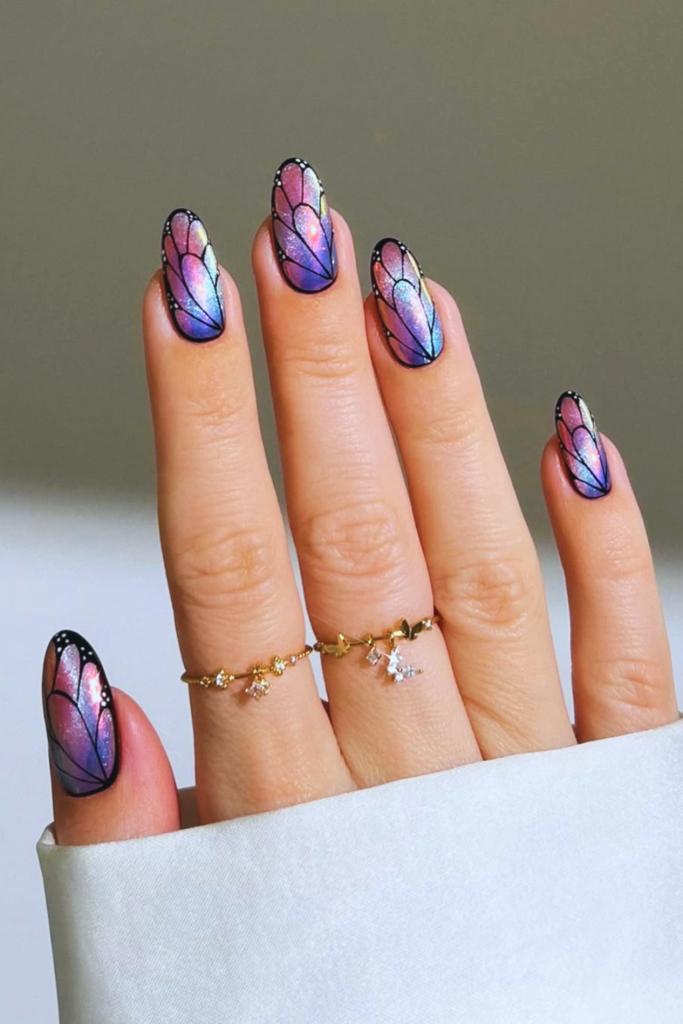 Butterfly accent festival nails with delicate wing designs and soft feminine nail art