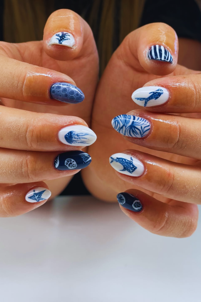 coastal aesthetic nails with muted blue and white tones