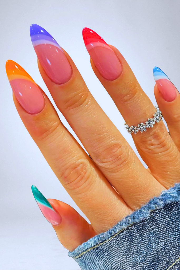 Colorful French tip festival nails with bright modern twist on classic nail design