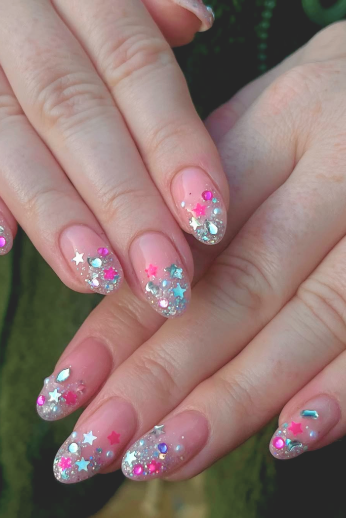 Crystal embellished festival nails with large gems and bold statement nail art design