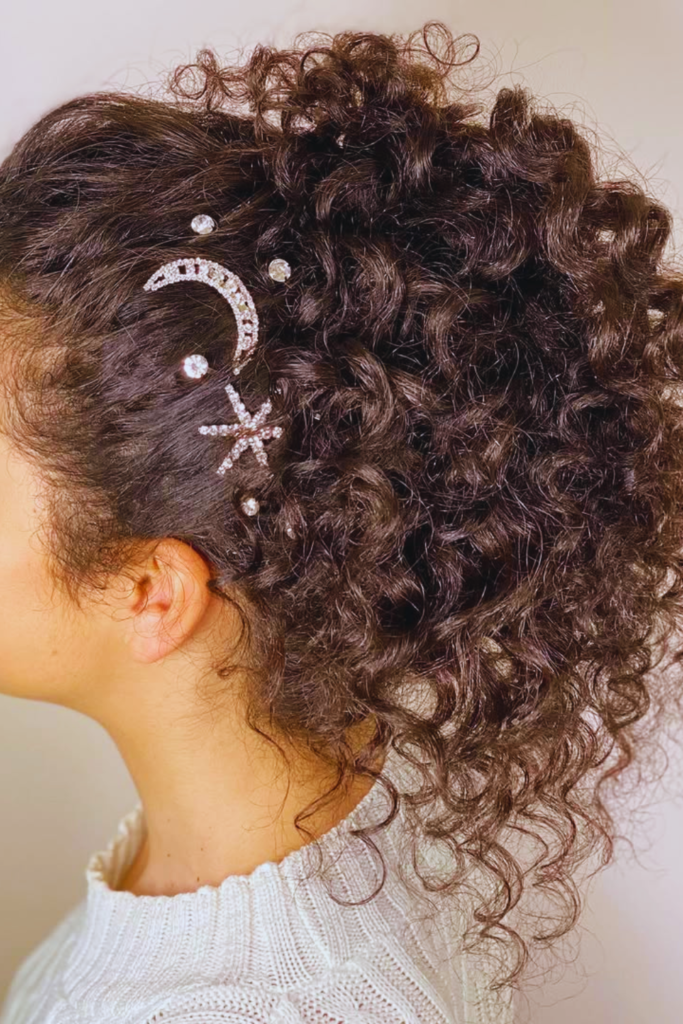 Curly high puff with accessories natural festival hairstyle idea