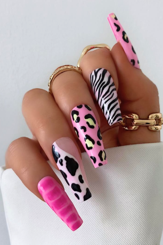 Funky animal print nails with bold colors and modern nail design pattern