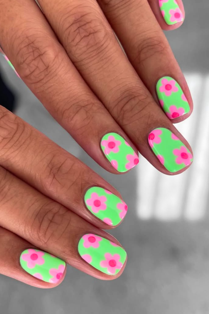 Funky floral summer nails with colorful flowers and bold nail art design