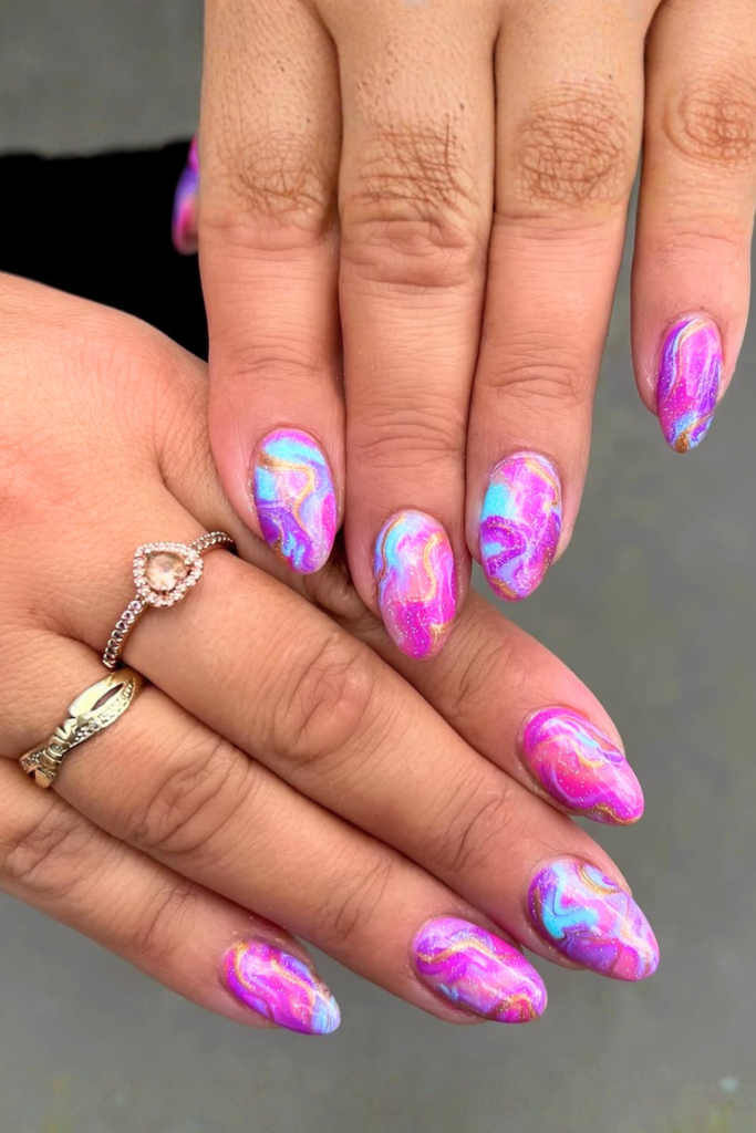 Funky marble nail designs with colorful swirl pattern and bold nail art