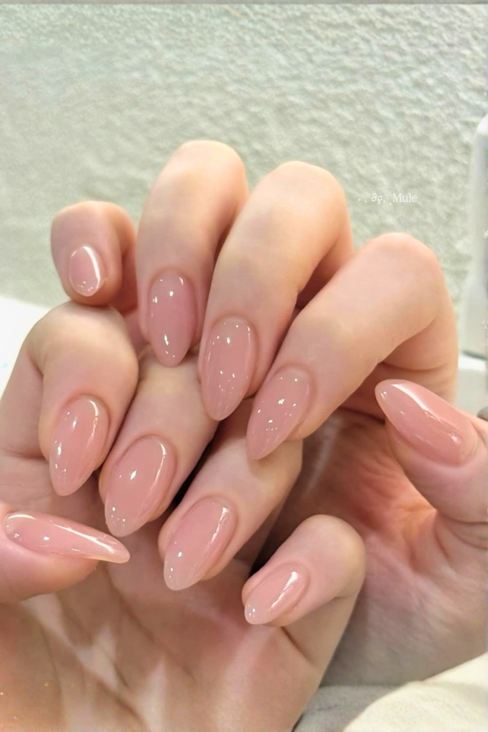 glossy nude summer birthday nails with clean natural finish and soft shine