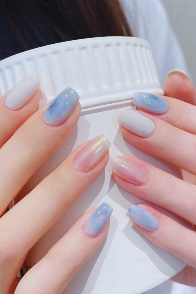 iridescent blue nails color shifting glossy nail design
