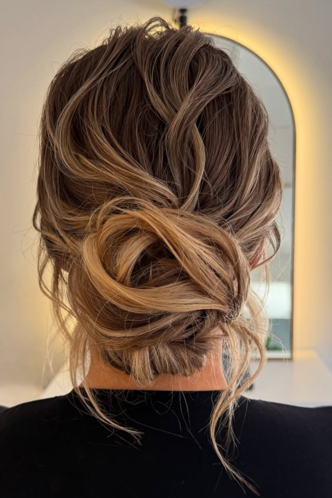 Messy low bun with layers soft festival hairstyle for summer