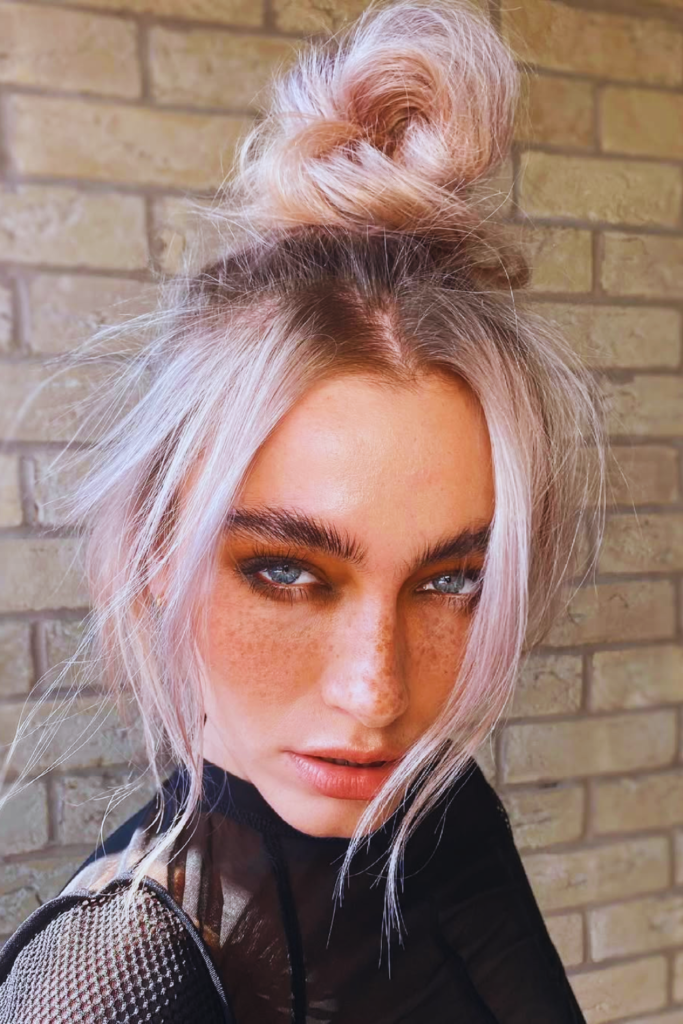 Messy top knot easy festival hairstyle for hot weather