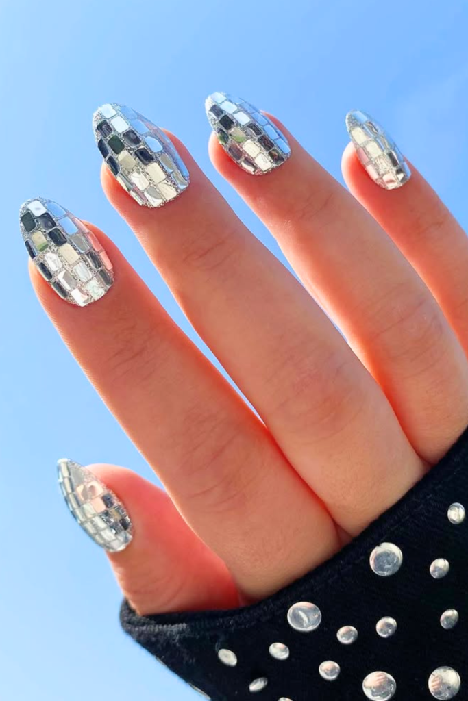 Metallic foil festival nails with textured gold and silver accents for modern nail art