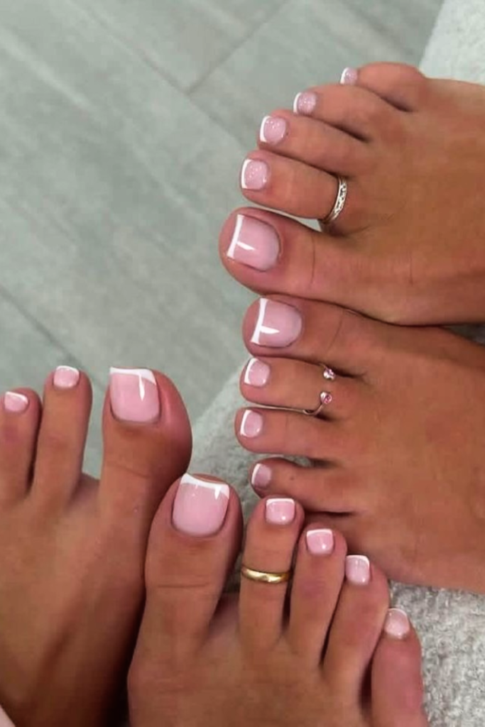 micro French tip toe nails with thin white edges, simple summer pedicure design for minimalist nail look