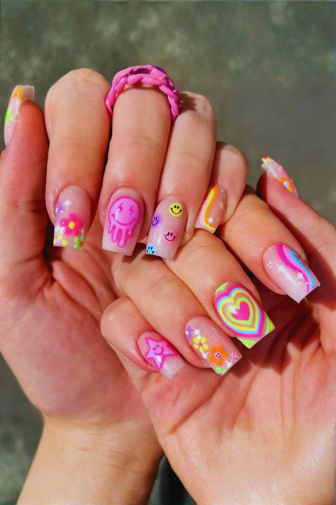 Mix and match festival nail designs with different patterns on each nail for trendy look