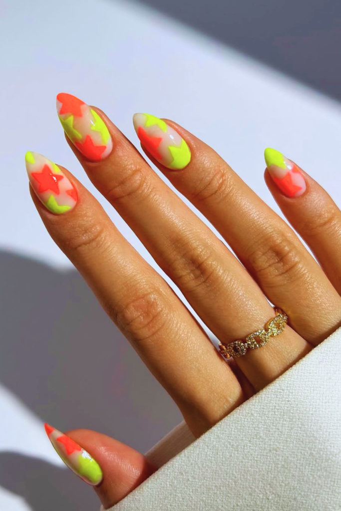 Neon rave nails with bright glow colors and bold acrylic nail design for night festivals and parties
