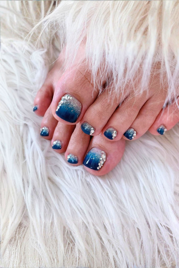 ocean blue swirl toe nails with wave design, beach inspired summer pedicure idea for vacation nails