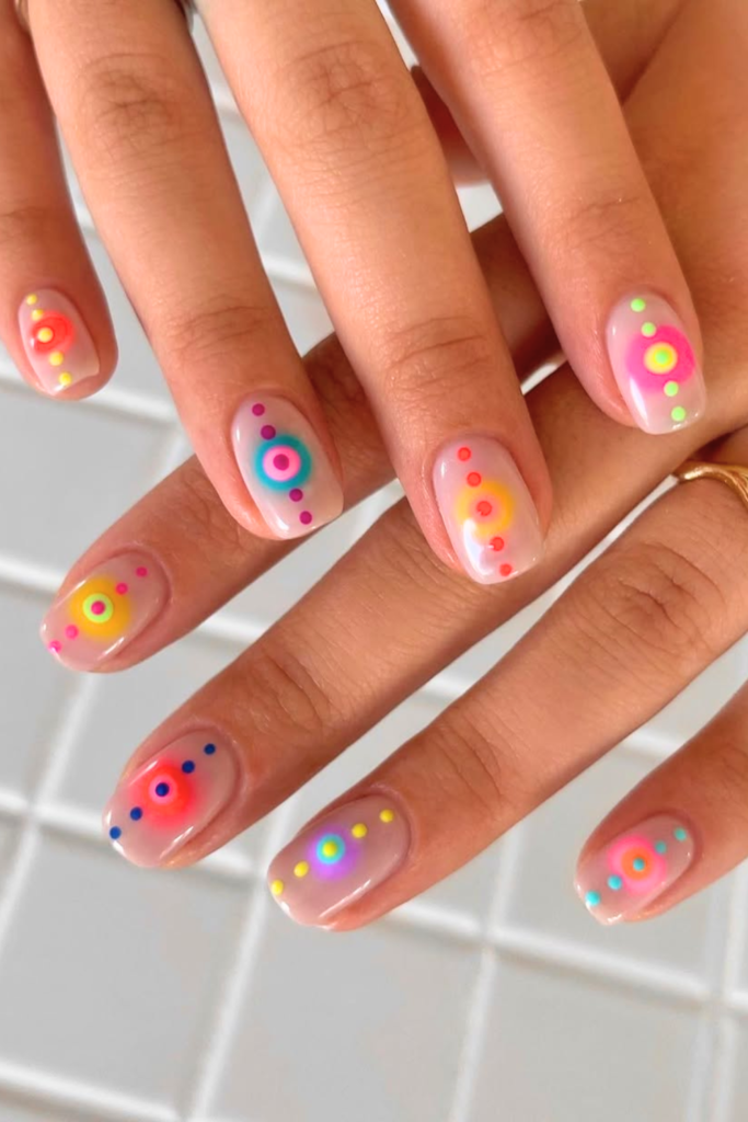 Pastel aura festival nails with soft gradient tones and dreamy spring nail design