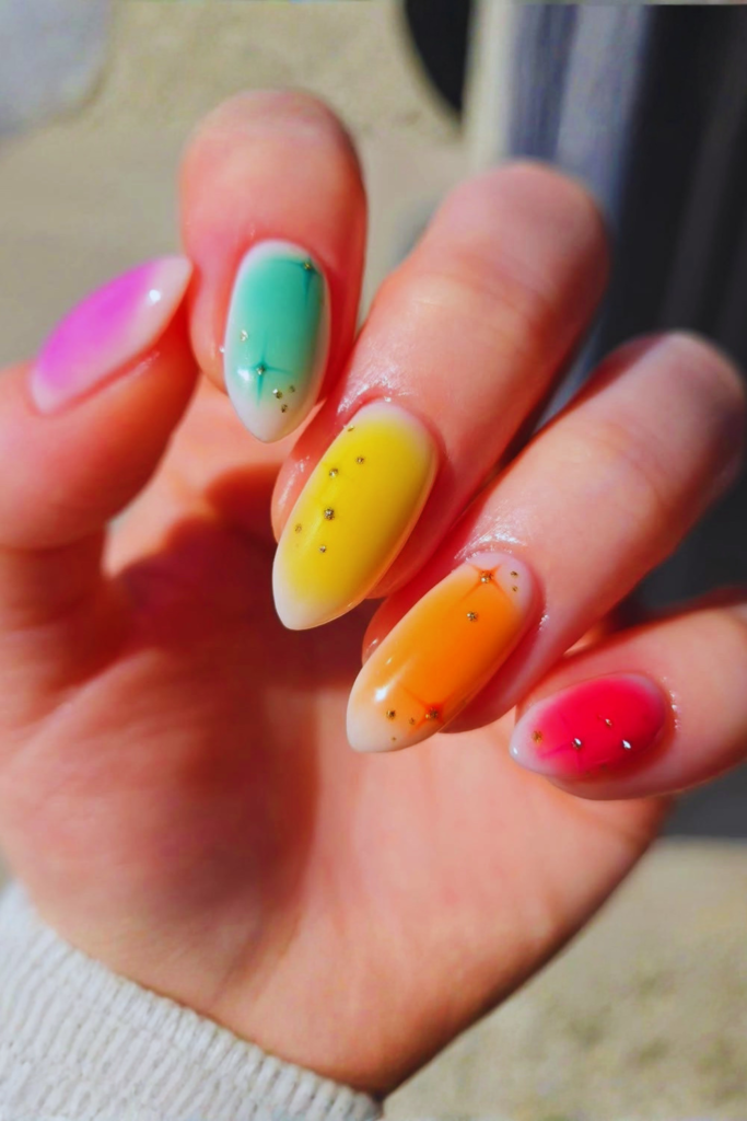Skittle color festival nails with each nail painted in different bright shades