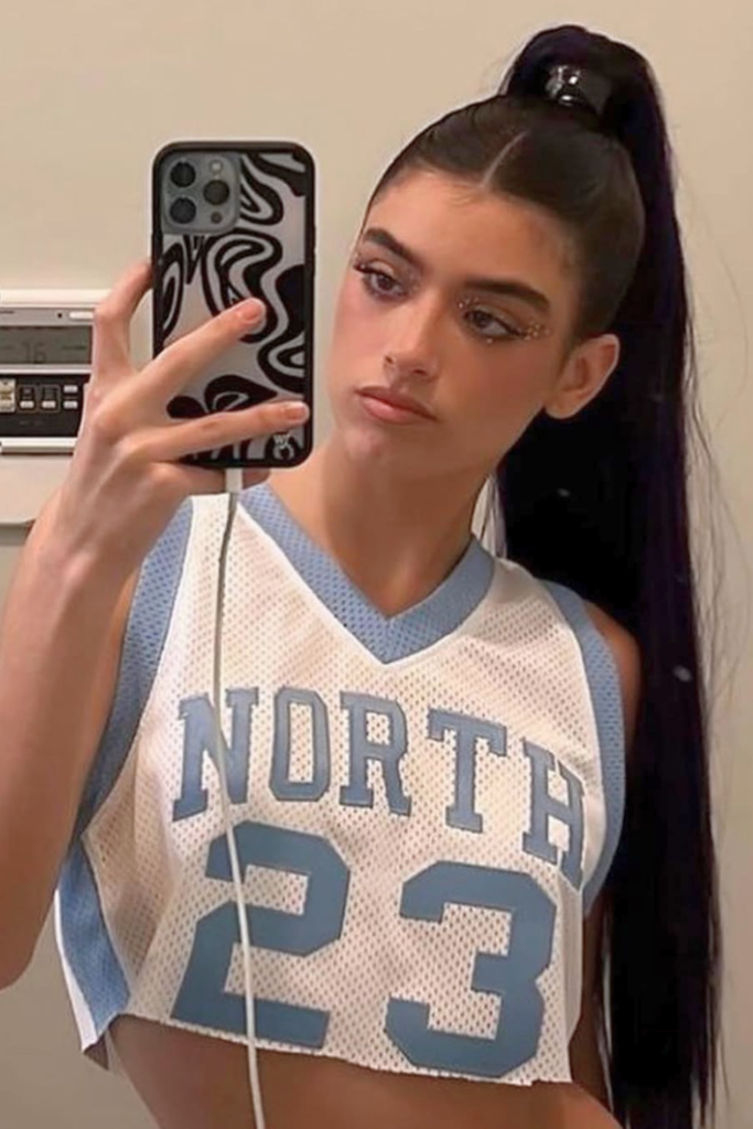 Sleek high ponytail with wrap polished festival hair idea