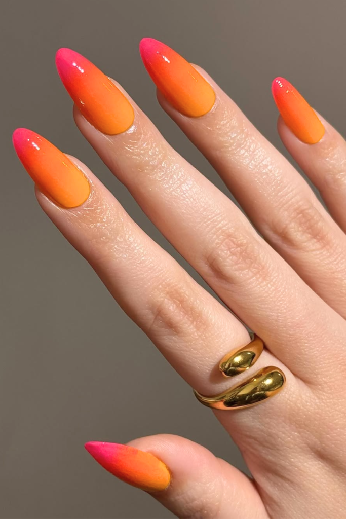 sunset ombre summer birthday nails with warm gradient colors and glossy finish