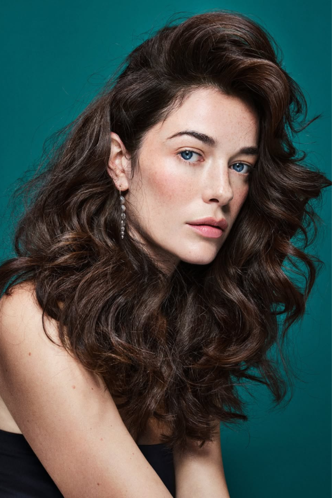 Voluminous blowout festival hairstyle with bouncy long hair