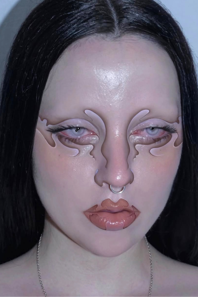 Futuristic aliencore makeup with chrome eyes and reflective skin