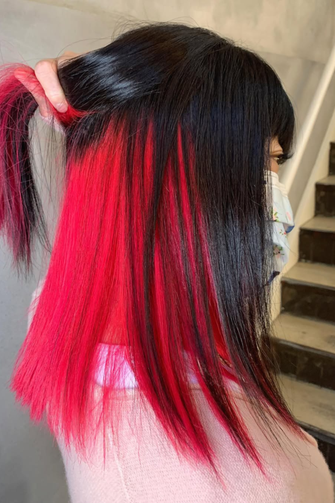 Black hair with deep red underlayer color