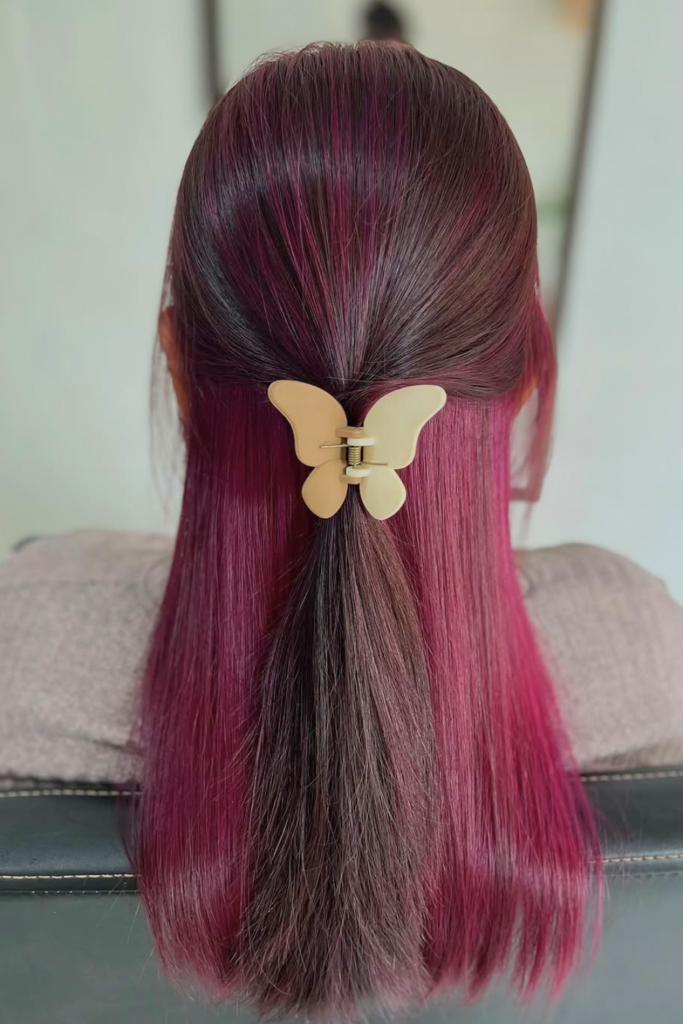 Cherry cola peekaboo hair on layered brunette hair