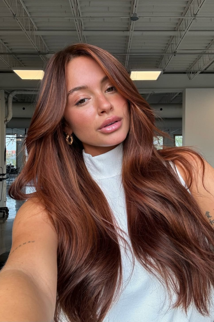 Cinnamon brunette hair with warm copper dimension