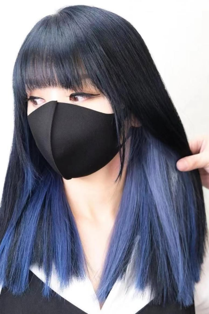 Cool blue peekaboo hair on dark hair