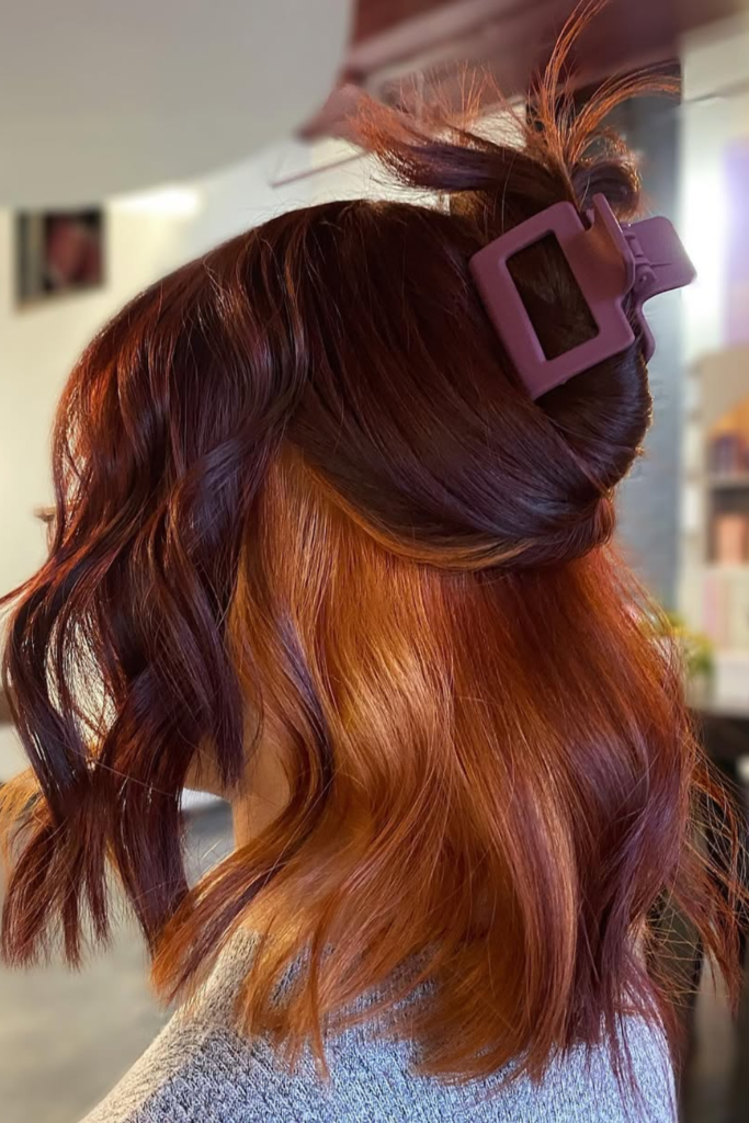 Copper peekaboo hair on dark brunette hair
