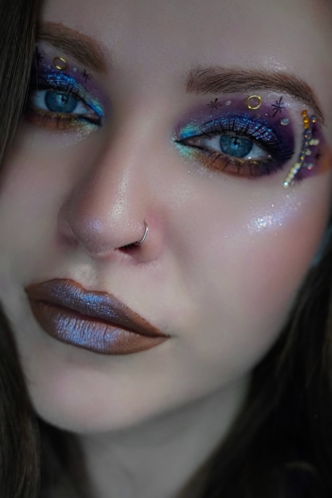 Galaxy makeup aesthetic with celestial shimmer and cosmic glam