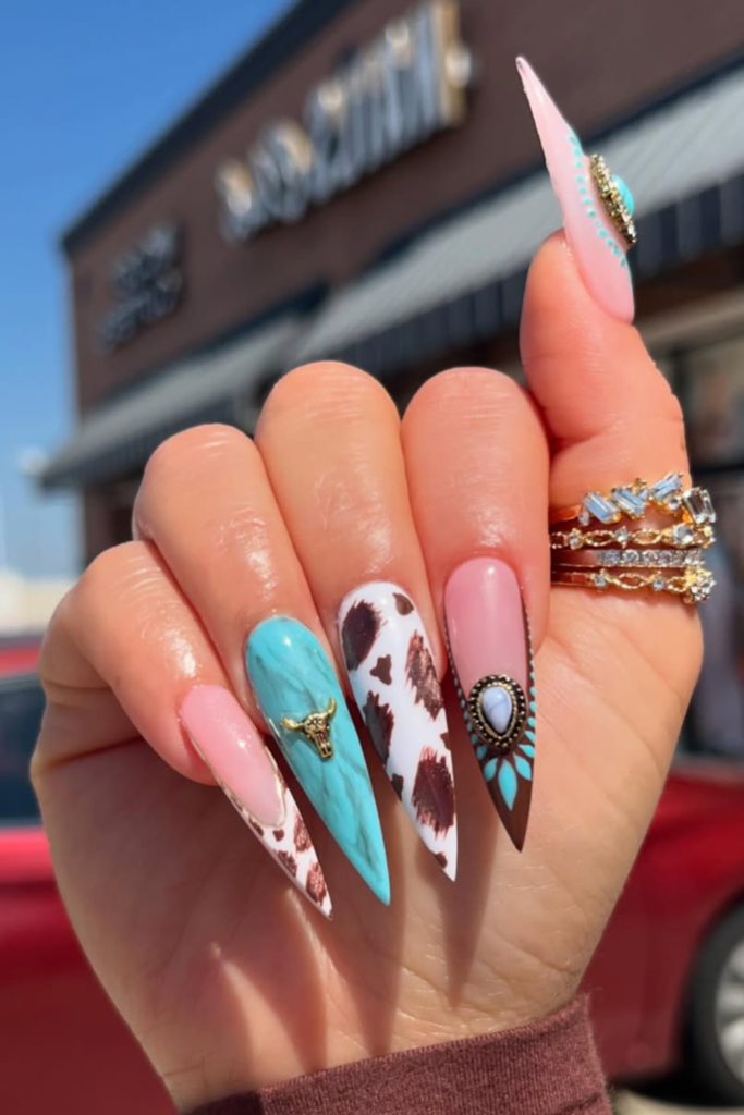 Cow print accent nails with western glam style