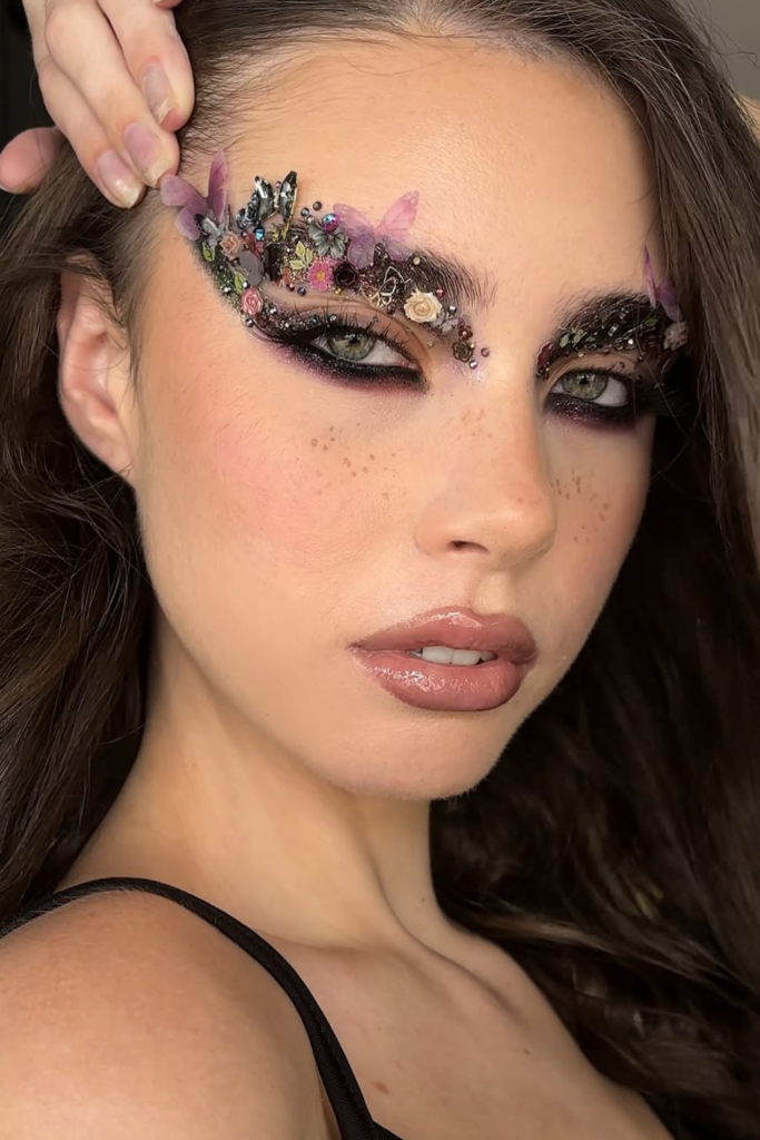 Dark fairycore makeup with earthy shimmer and smoky eyes