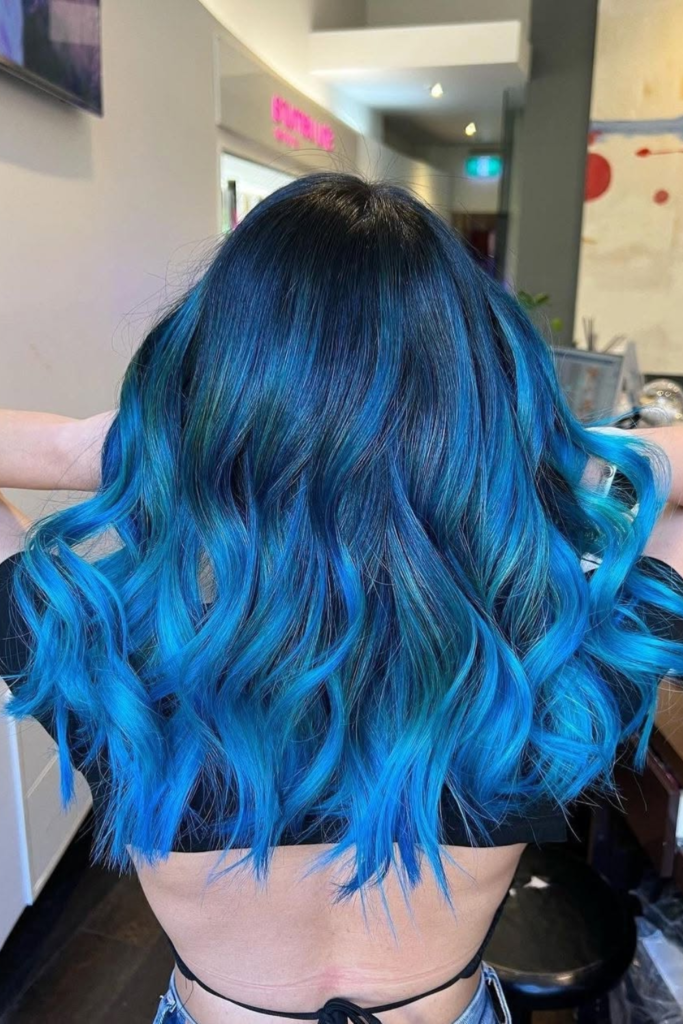 Electric blue bold hair color with vivid tones
