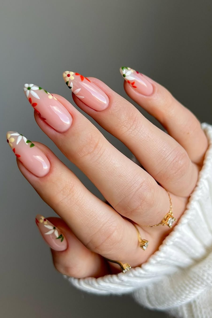 Floral manicure with delicate French design