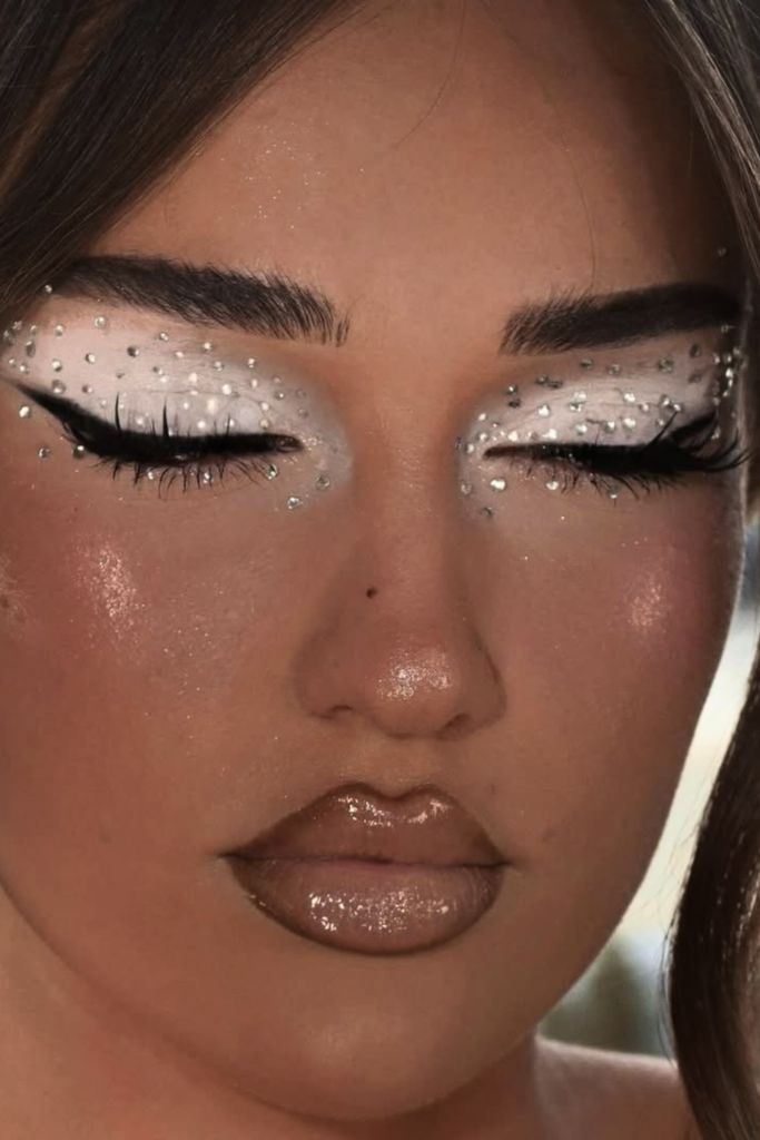 Icy celestial makeup with silver shimmer and glowing skin