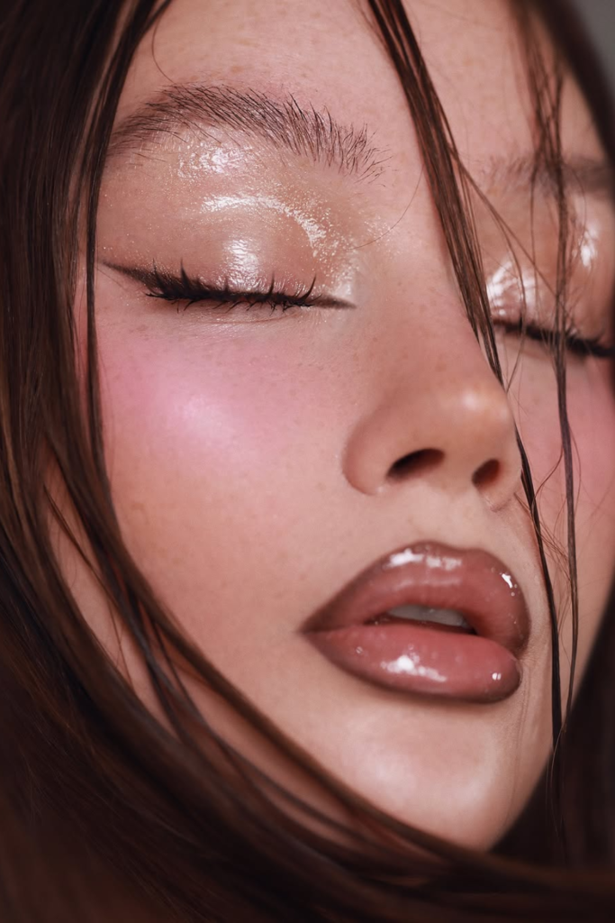 Glass skin fantasy glam with luminous reflective makeup