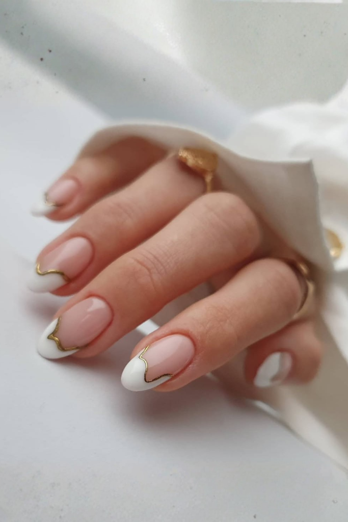 Gold outline French manicure with luxury nail design