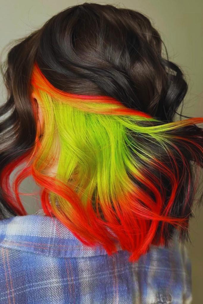 Hidden neon underlayer bold hair color idea