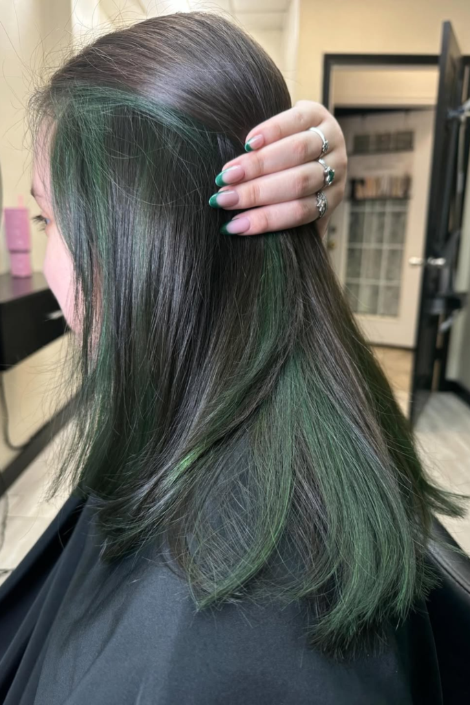 Jade green hidden hair color on brunette hair