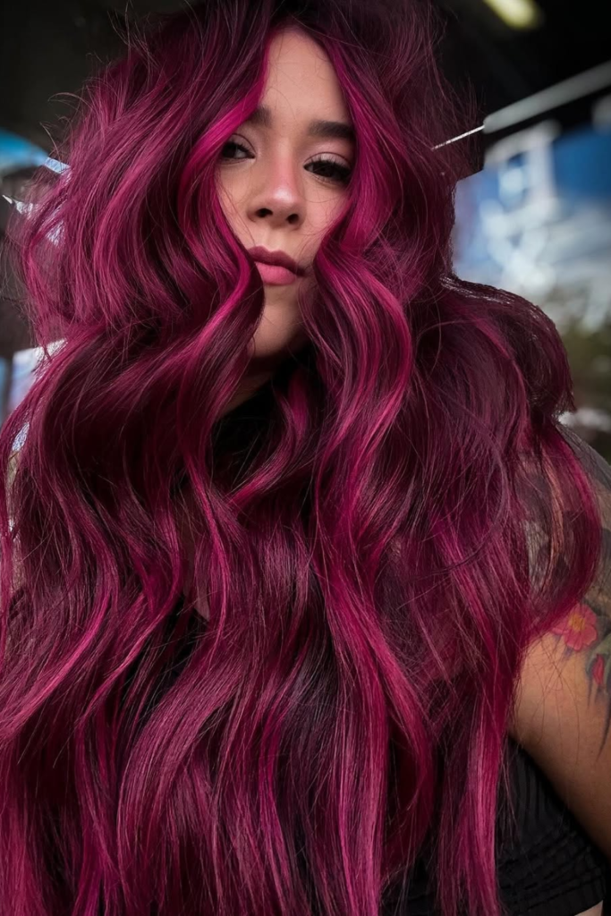 Magenta balayage hair color on dark base