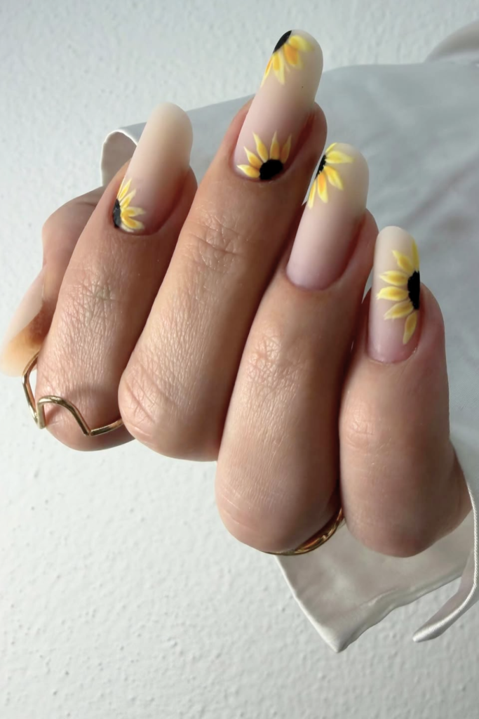 matte finish nails with soft sunflower design minimal style