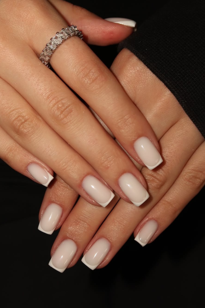 Milky white French manicure on almond nails