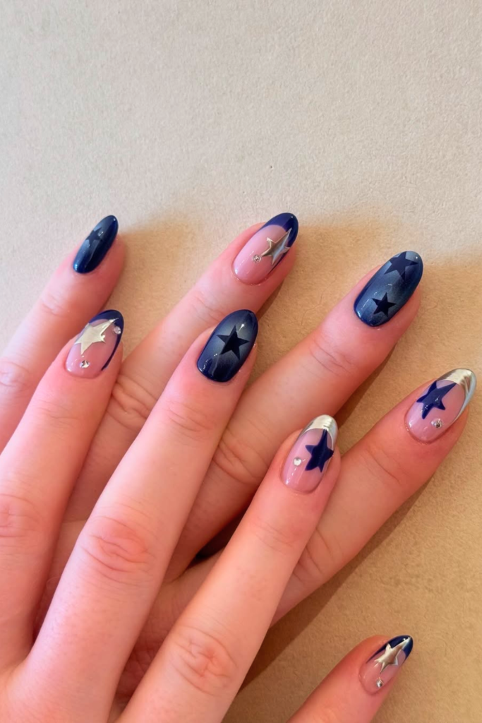 Minimal chrome star nails with glossy polish and silver patriotic nail accents