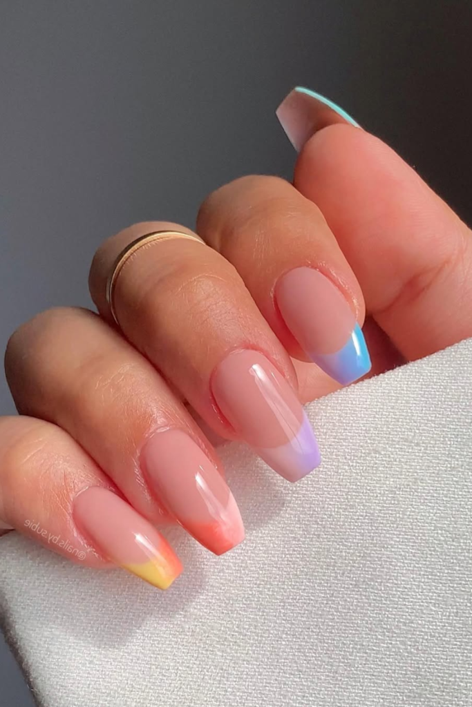Pastel rainbow French tips with colorful manicure design